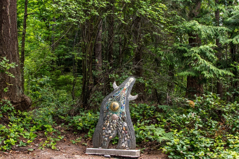 "Madonna" sculpture with green forest background