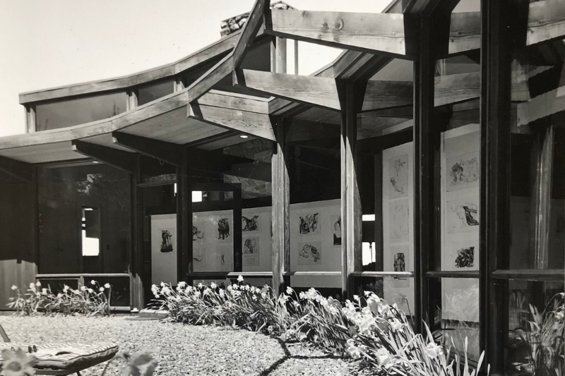 Black and White photo of the Webster house and courtyard. View of the windows and entrance.